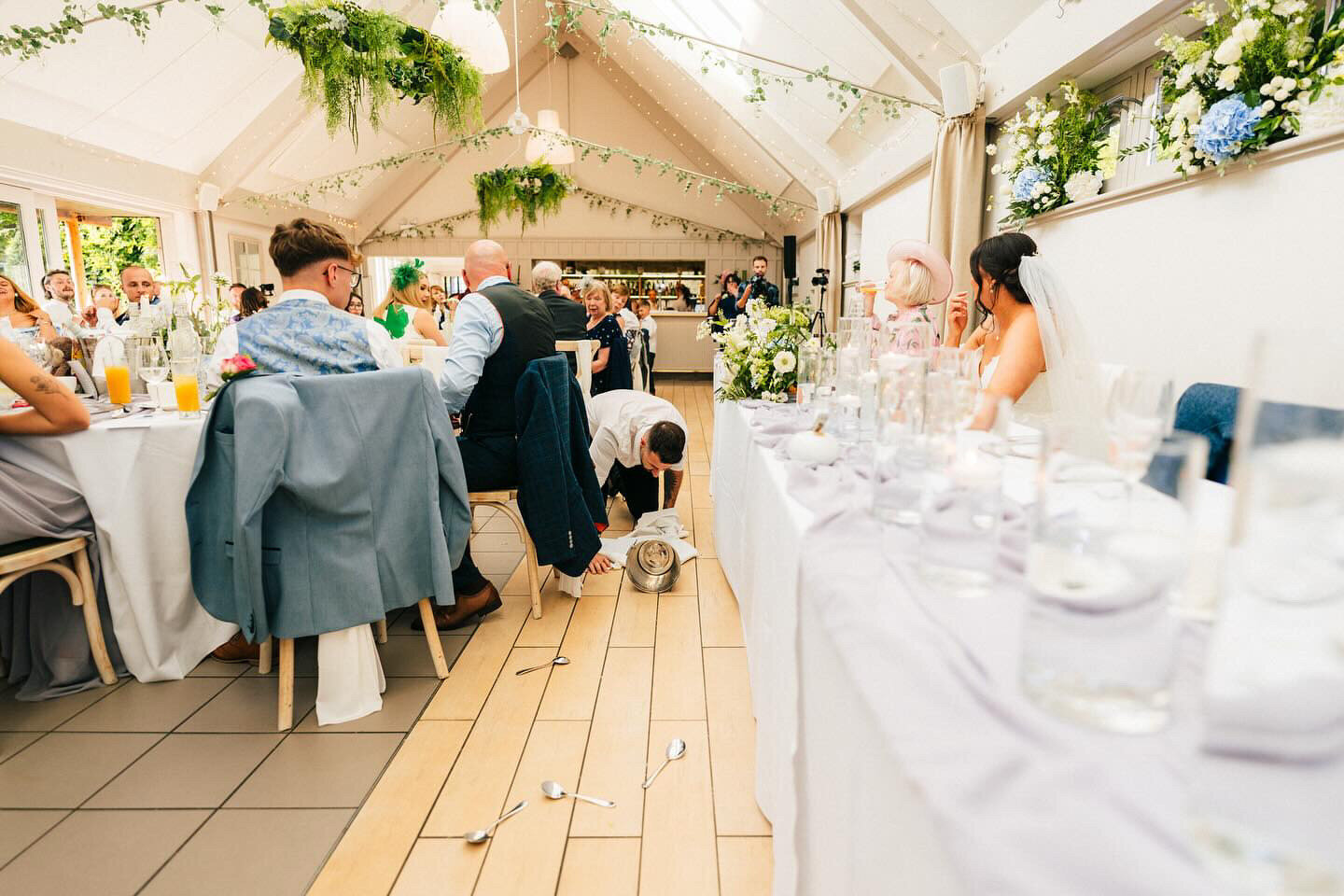 Singing waiters performing at a long-table wedding breakfast