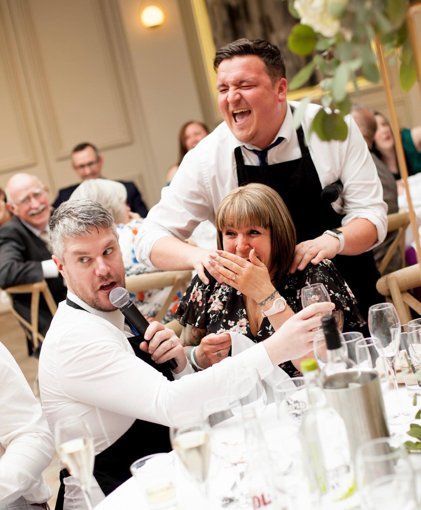 Singing waiters surprising wedding guests mid-meal