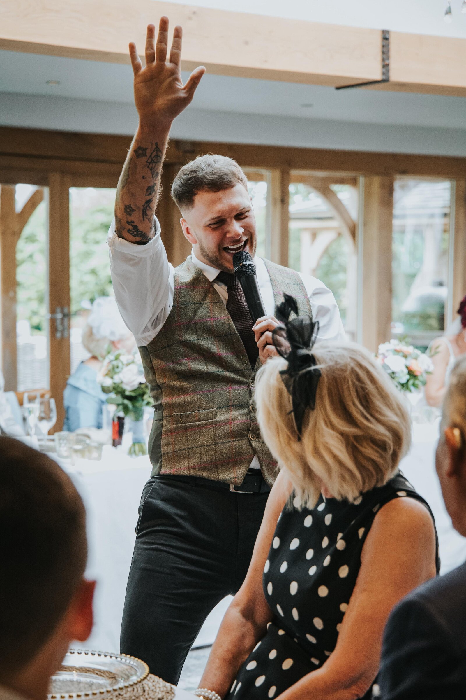 Singing waiter performing to wedding guests