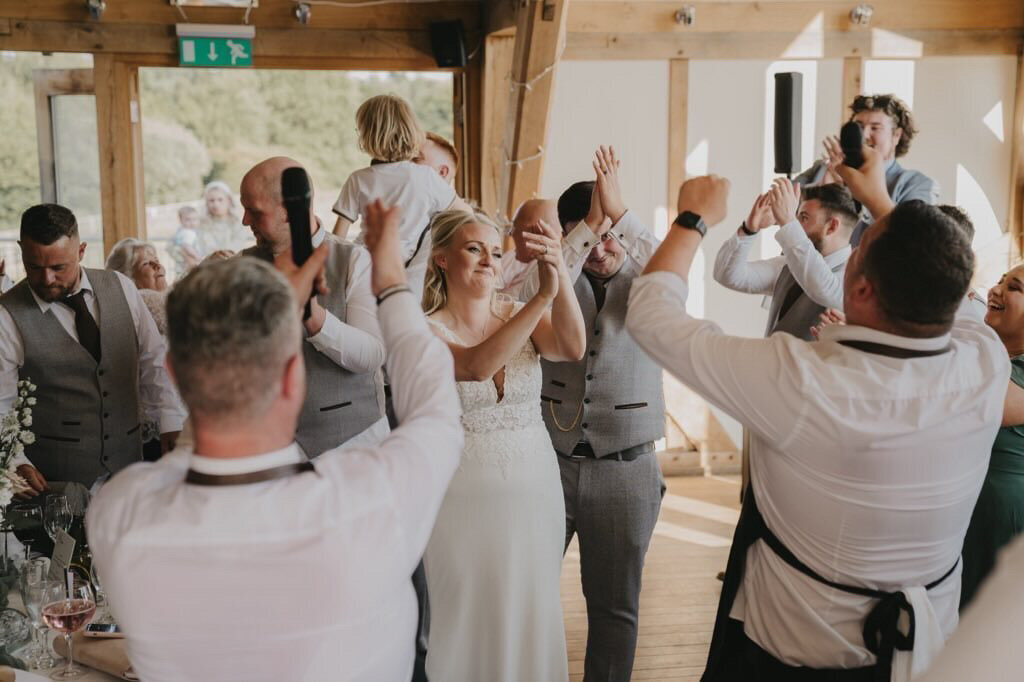 Guests joining in with a singing waiters performance
