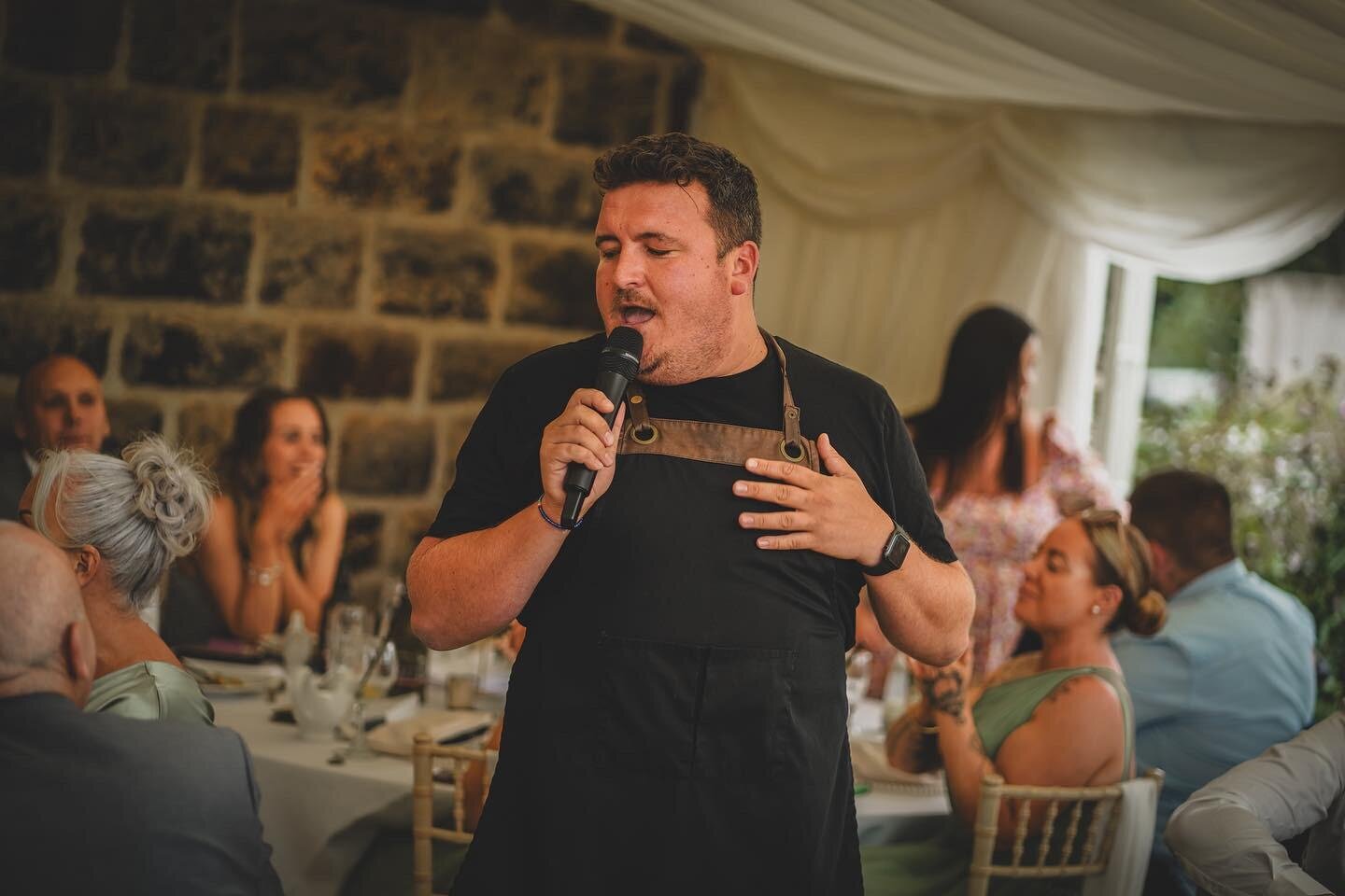 Singing waiter performing at a candlelit wedding breakfast