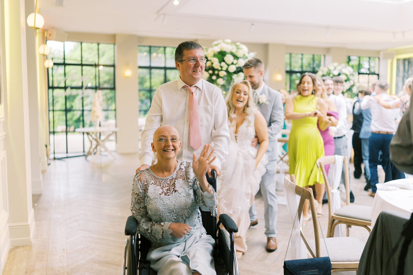 Wedding guests dancing with the singing waiters