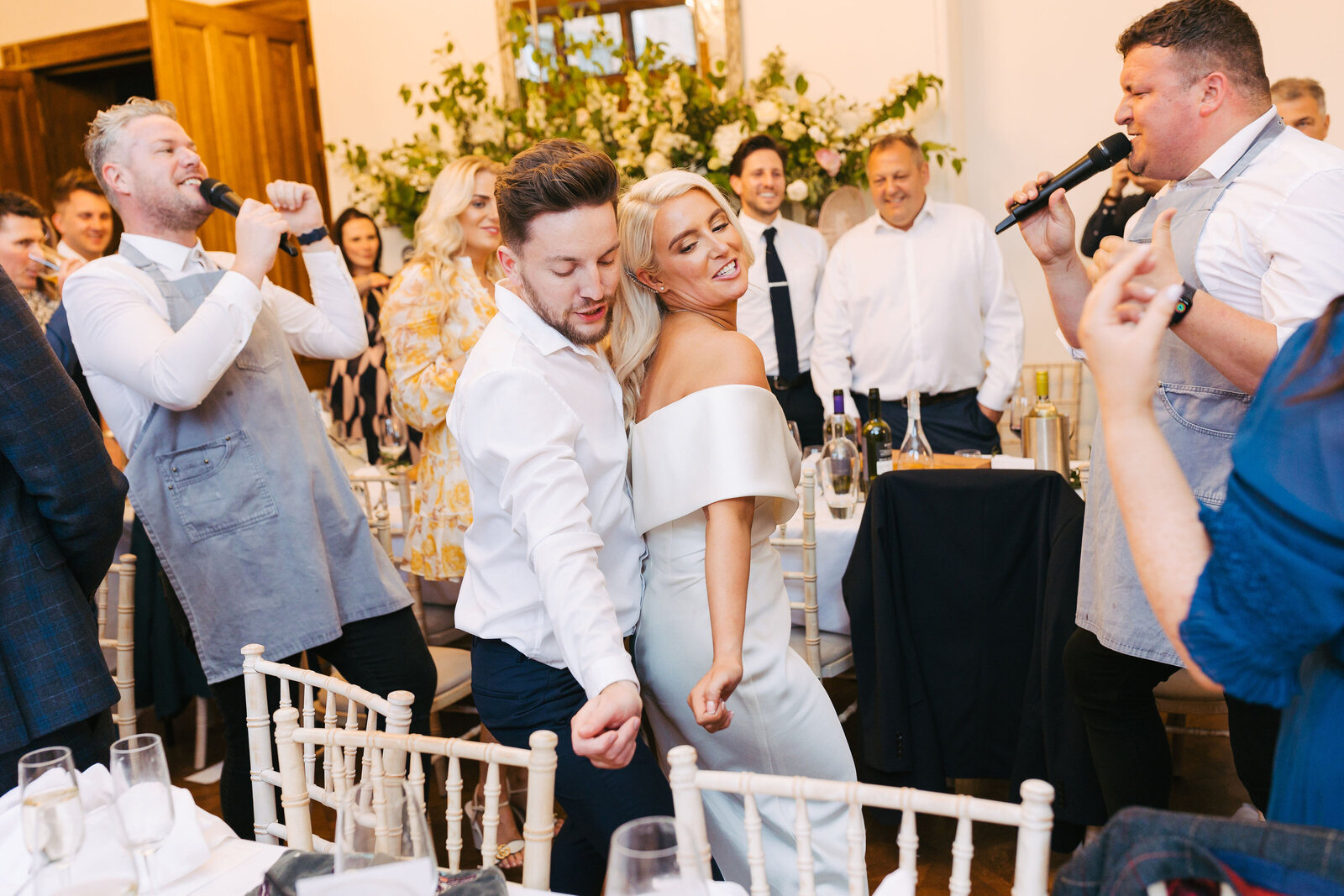 Singing waiters performing with the bride and groom at their wedding reception
