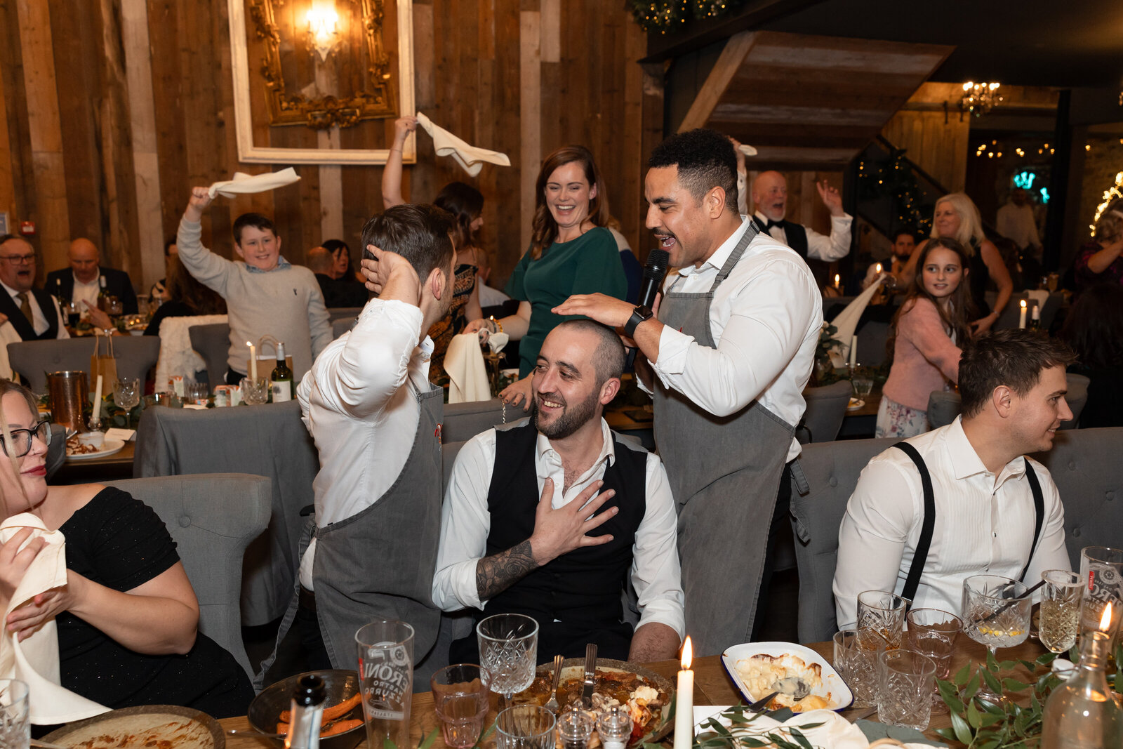 Singing waiters getting the whole wedding party singing along