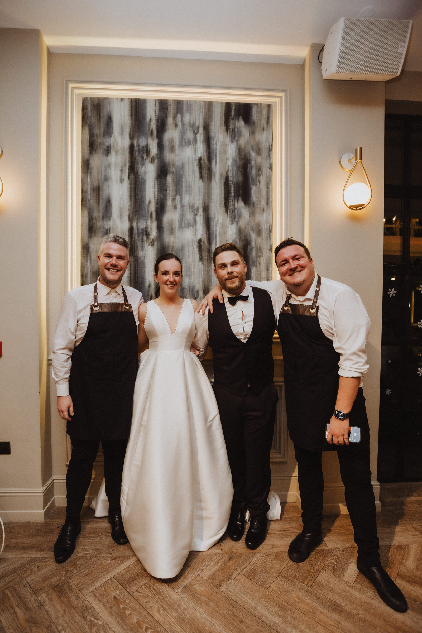 Singing waiters with a bride on her wedding day